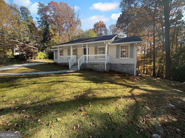 single story home featuring a front lawn and covered porch