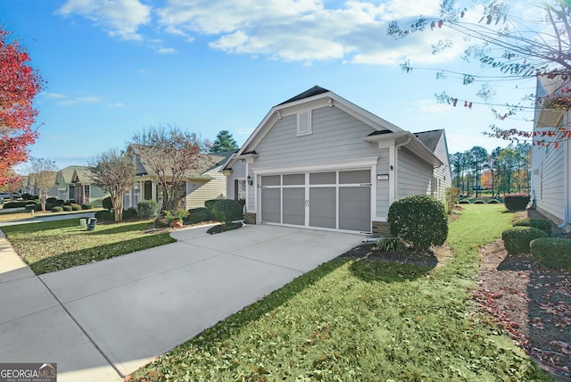 view of home's exterior featuring a lawn and a garage