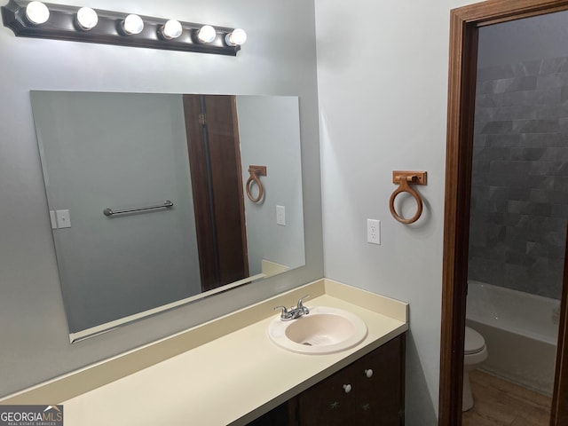 full bath featuring toilet and vanity