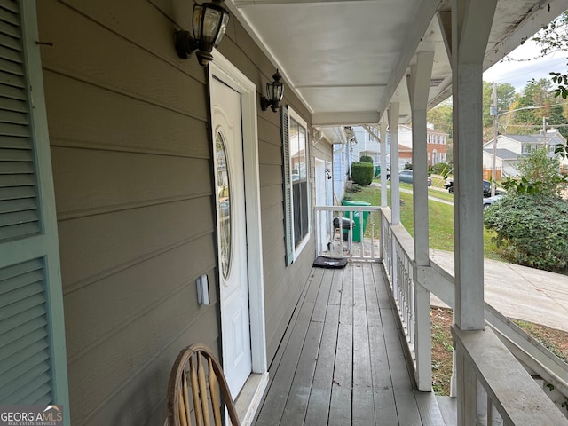 wooden deck featuring covered porch