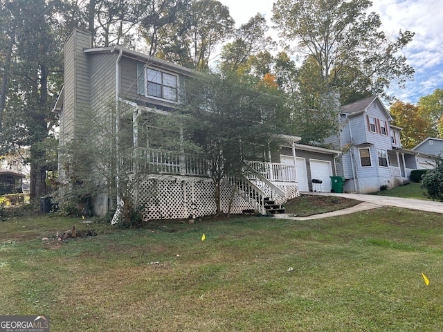 view of front of home featuring a chimney, driveway, stairway, and a front yard