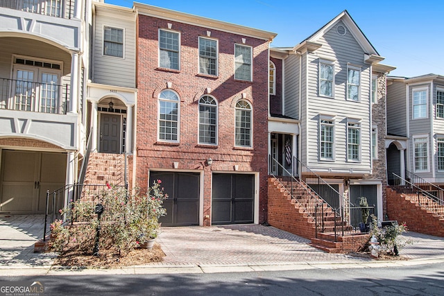 townhome / multi-family property featuring a garage