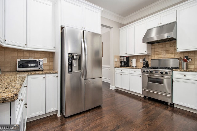 kitchen featuring white cabinets, appliances with stainless steel finishes, dark hardwood / wood-style flooring, and stone counters