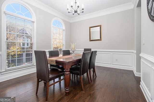 dining area featuring dark hardwood / wood-style floors, crown molding, and a healthy amount of sunlight