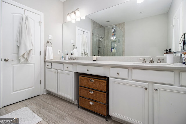 bathroom with vanity and an enclosed shower