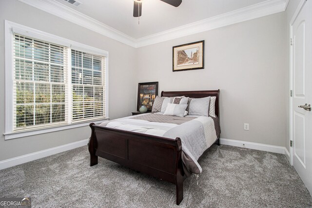 stairway with ceiling fan, wood-type flooring, and crown molding