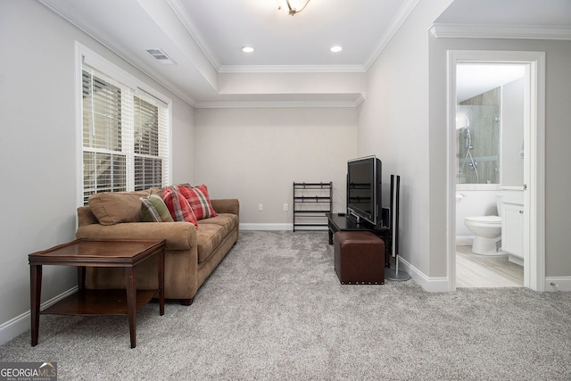 sitting room with light carpet and ornamental molding