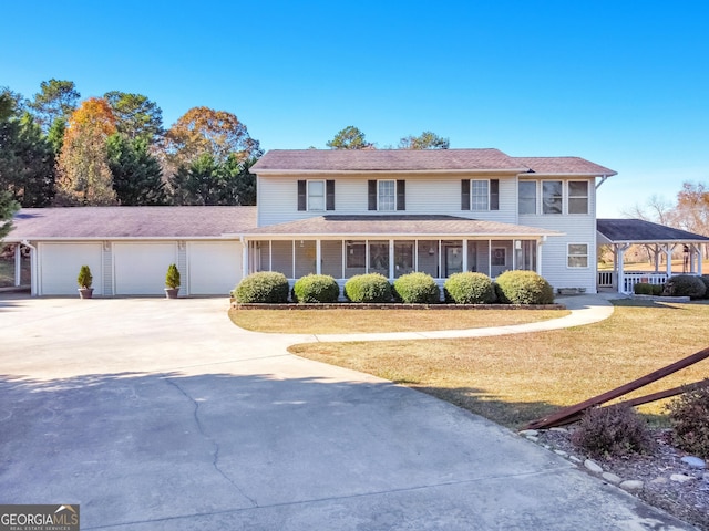 view of front of house with a front lawn and a garage