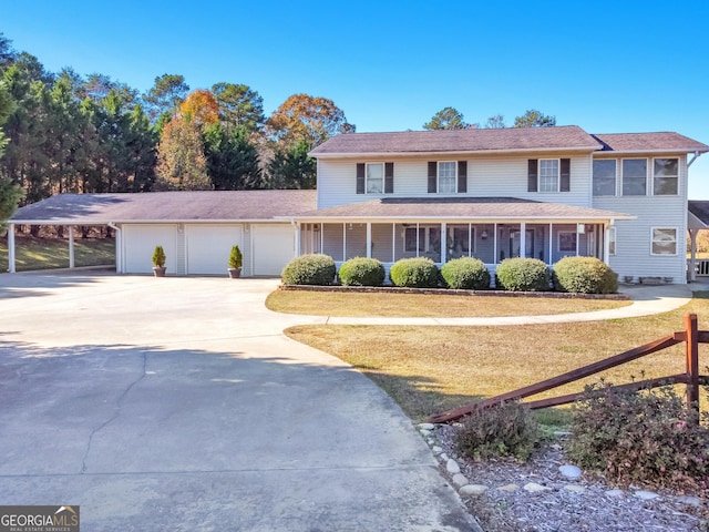 view of front of house featuring covered porch, a garage, a carport, and a sunroom