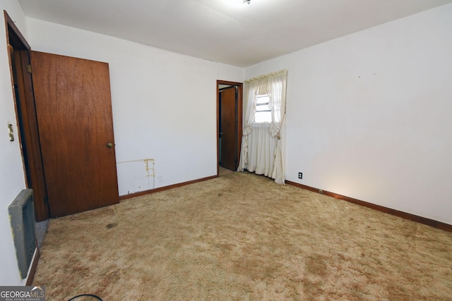 unfurnished bedroom with light carpet