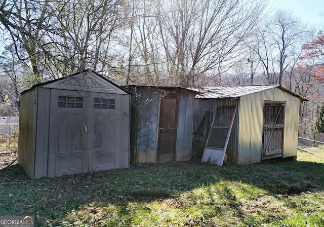 view of outbuilding featuring a yard