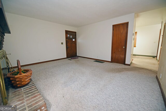 unfurnished living room with carpet