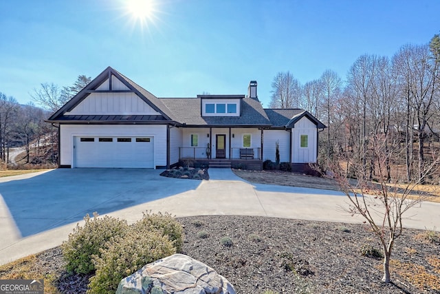 view of front facade featuring covered porch and a garage