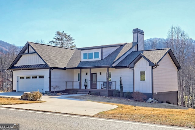 view of front of house with a porch and a garage