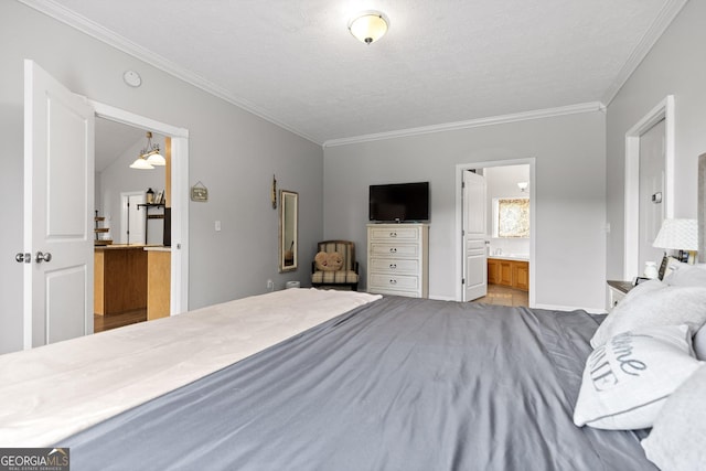 bedroom featuring ornamental molding, a textured ceiling, and ensuite bath