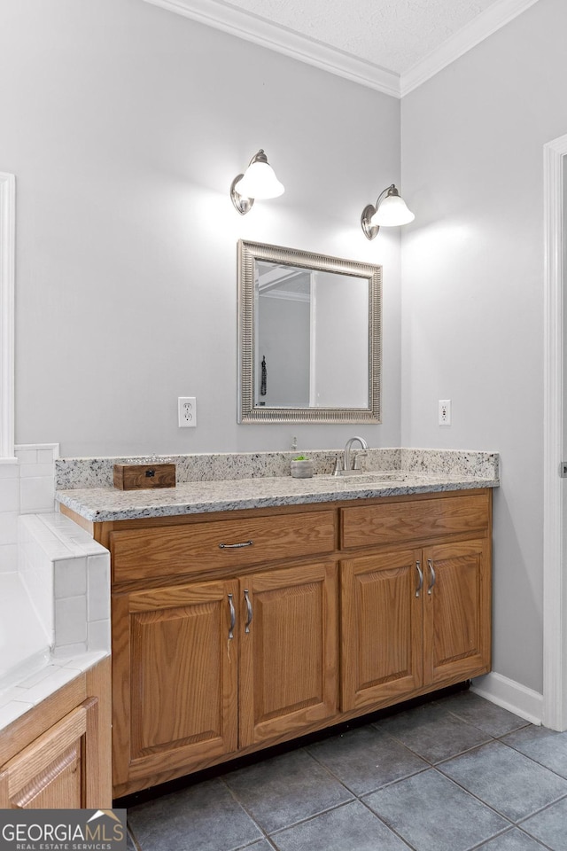 bathroom with tile patterned flooring, vanity, crown molding, and a textured ceiling