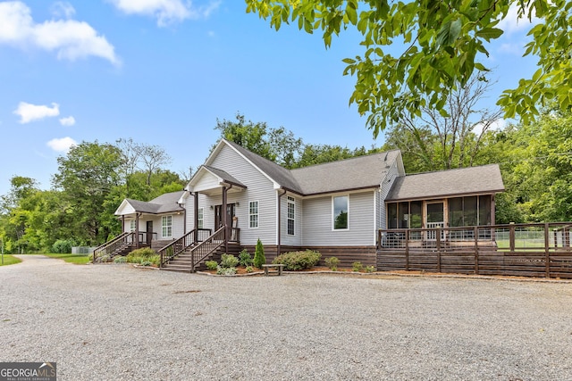 view of front of property with a sunroom