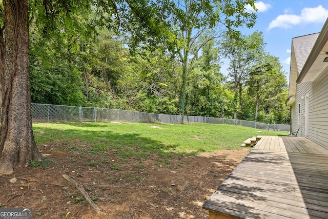 view of yard featuring a wooden deck