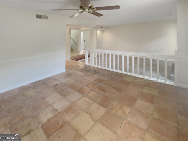 2007 Variations Dr NE, Atlanta, GA 30329 - empty room with ceiling fan and stone finish floors