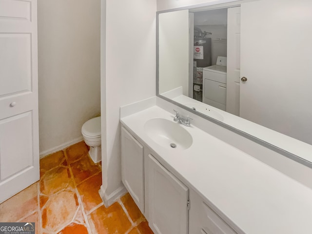 2007 Variations Dr NE, Atlanta, GA 30329 - half bathroom featuring washer / dryer, toilet, vanity, tile patterned flooring, and water heater