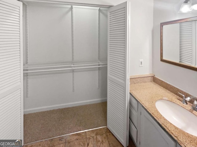 bathroom with tile patterned floors and vanity