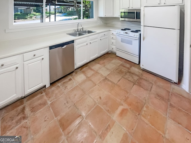 2007 Variations Dr NE, Atlanta, GA 30329 - kitchen with stainless steel appliances, a sink, white cabinets, light countertops, and light stone finish flooring