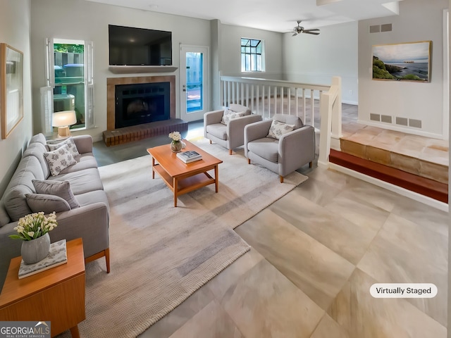 2007 Variations Dr NE, Atlanta, GA 30329 - living room featuring a ceiling fan and a fireplace with raised hearth