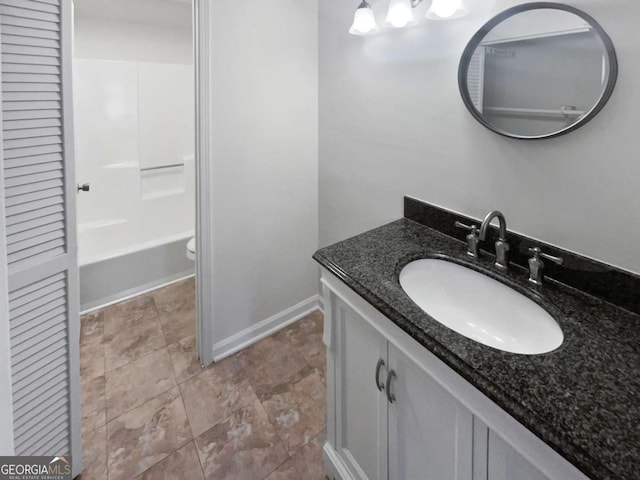 full bathroom with vanity, toilet, and shower / washtub combination