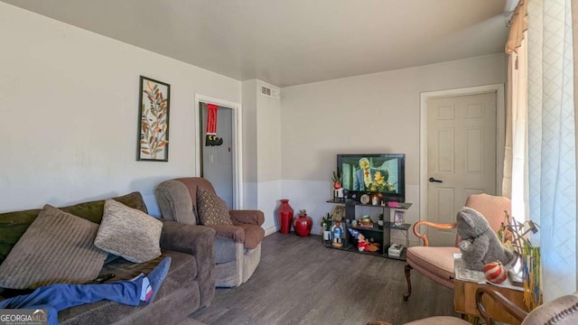 living room with dark hardwood / wood-style flooring