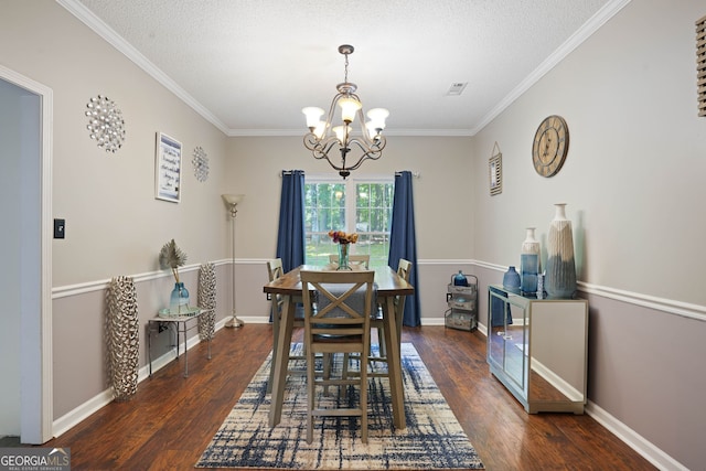 dining area with ornamental molding, dark hardwood / wood-style flooring, and a notable chandelier