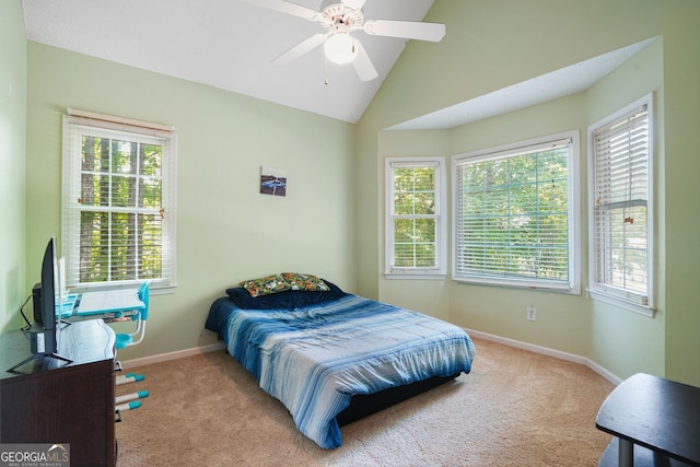 carpeted bedroom with ceiling fan, lofted ceiling, and multiple windows