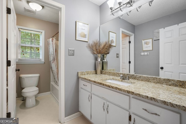 full bathroom with vanity, toilet, a textured ceiling, and shower / tub combo