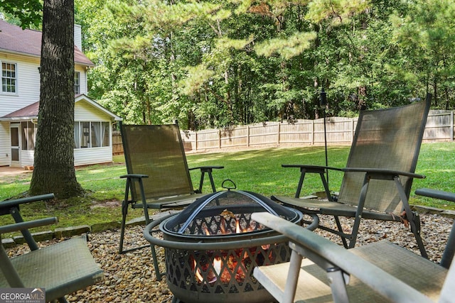 view of patio / terrace featuring an outdoor fire pit