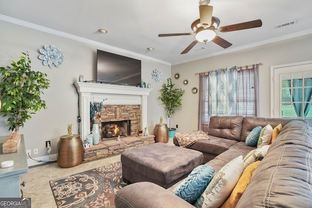 tiled living room with ceiling fan, ornamental molding, and a fireplace