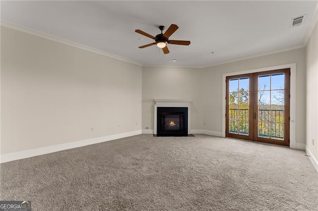 unfurnished living room featuring crown molding, ceiling fan, and carpet flooring