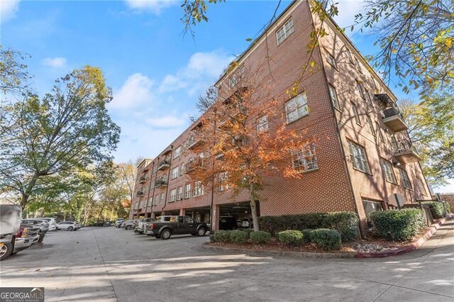 351 Washington Ave NE Ste 302, Marietta, GA 30060 - view of building exterior with uncovered parking