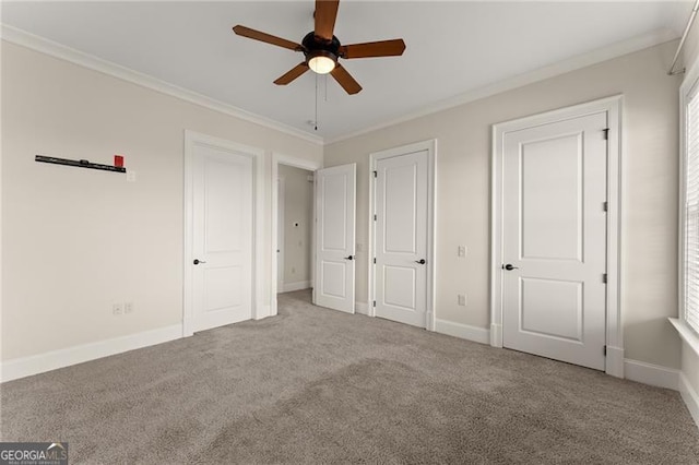 351 Washington Ave NE Ste 302, Marietta, GA 30060 - unfurnished bedroom with carpet, crown molding, baseboards, and a ceiling fan
