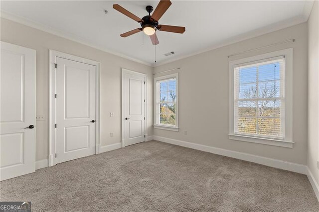 351 Washington Ave NE Ste 302, Marietta, GA 30060 - unfurnished bedroom featuring carpet, visible vents, baseboards, and ornamental molding