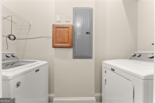 laundry room featuring separate washer and dryer and electric panel