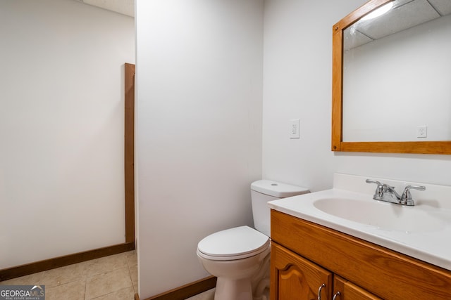 bathroom with tile patterned floors, vanity, and toilet