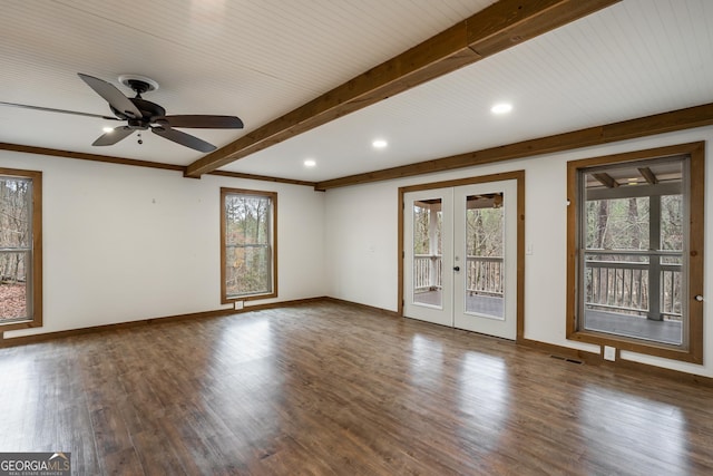 empty room with beam ceiling, dark hardwood / wood-style flooring, ceiling fan, and french doors