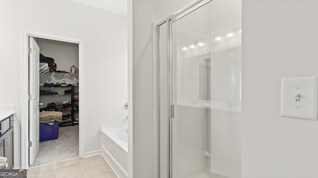 bathroom with separate shower and tub, tile patterned floors, and vanity