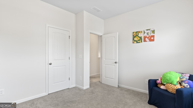 sitting room with light carpet