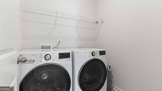 laundry room with washer and clothes dryer