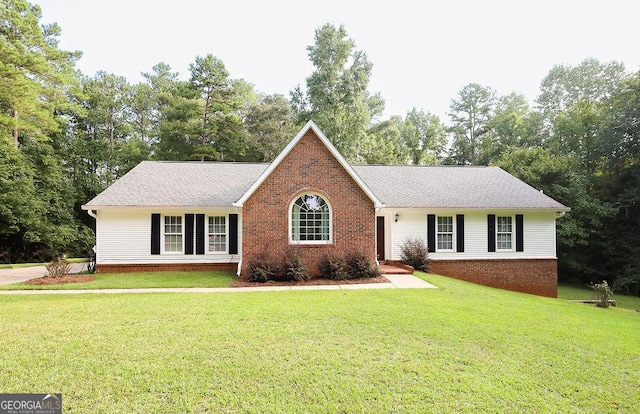 ranch-style house featuring a front yard