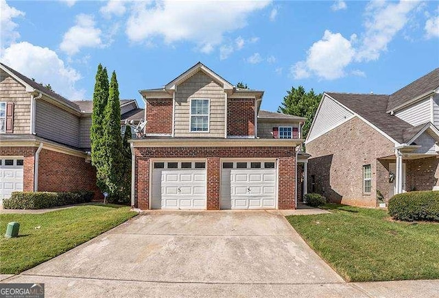 view of property with a garage and a front lawn