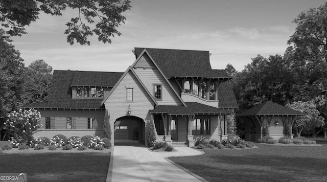 view of front facade with a garage, a front yard, driveway, and a shingled roof