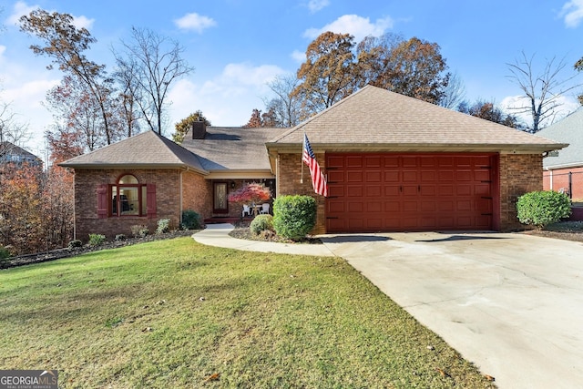 ranch-style home with a garage and a front yard