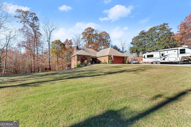 view of yard with a garage