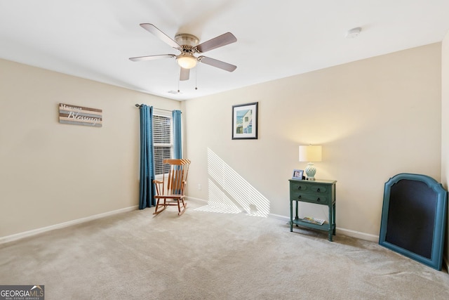 unfurnished room with light colored carpet and ceiling fan